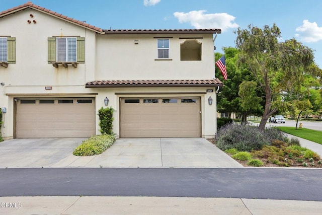 3224 Lisbon Ln, Oxnard, CA 93036 - mediterranean / spanish house with a garage, concrete driveway, stucco siding, and a tile roof