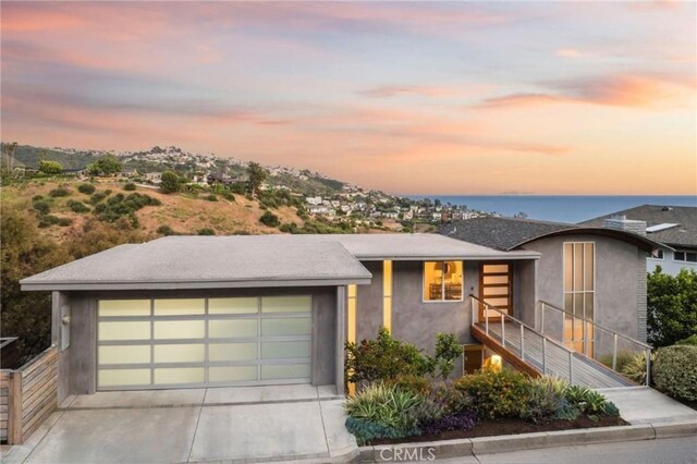 1385 Terrace Way, Laguna Beach, CA 92651 - view of front facade featuring stucco siding and concrete driveway