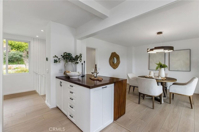 1385 Terrace Way, Laguna Beach, CA 92651 - kitchen featuring light wood finished floors, white cabinets, wooden counters, recessed lighting, and beam ceiling