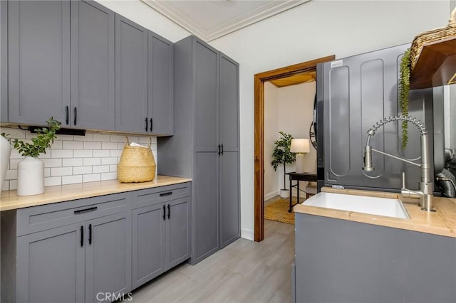 1385 Terrace Way, Laguna Beach, CA 92651 - kitchen featuring gray cabinets, backsplash, light countertops, and light wood-type flooring