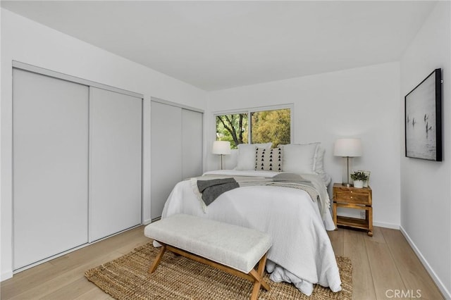 1385 Terrace Way, Laguna Beach, CA 92651 - bedroom with multiple closets and wood finished floors