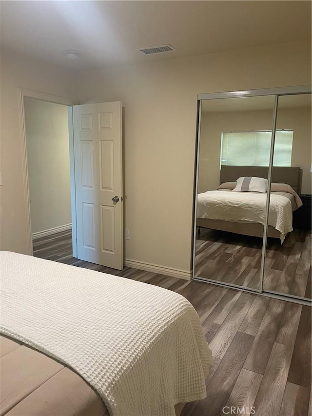 45461 Saigon Ave, Lancaster, CA 93534 - bedroom with a closet, wood finished floors, and baseboards