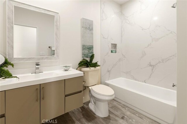 453 N 13th St, Grover Beach, CA 93433 - bathroom with vanity, wood finished floors, and washtub / shower combination