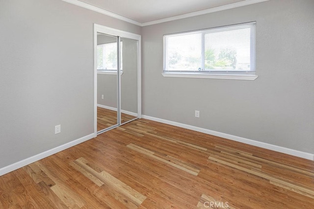 3760 Fielding Cir, Sacramento, CA 95826 - unfurnished bedroom with ornamental molding, baseboards, wood finished floors, and a closet