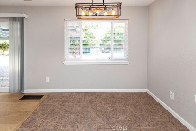 3760 Fielding Cir, Sacramento, CA 95826 - unfurnished dining area with baseboards and a chandelier