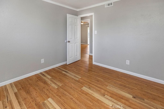 3760 Fielding Cir, Sacramento, CA 95826 - unfurnished room featuring baseboards, crown molding, and light wood finished floors