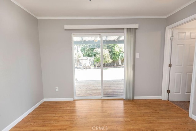 3760 Fielding Cir, Sacramento, CA 95826 - unfurnished room featuring light wood-style flooring, crown molding, and baseboards