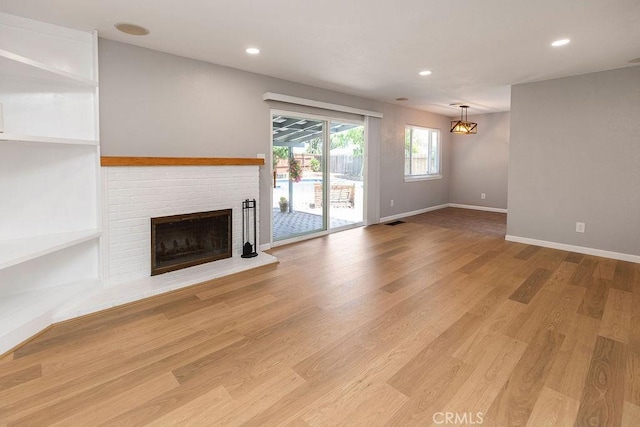 3760 Fielding Cir, Sacramento, CA 95826 - unfurnished living room featuring a fireplace, recessed lighting, baseboards, and light wood finished floors
