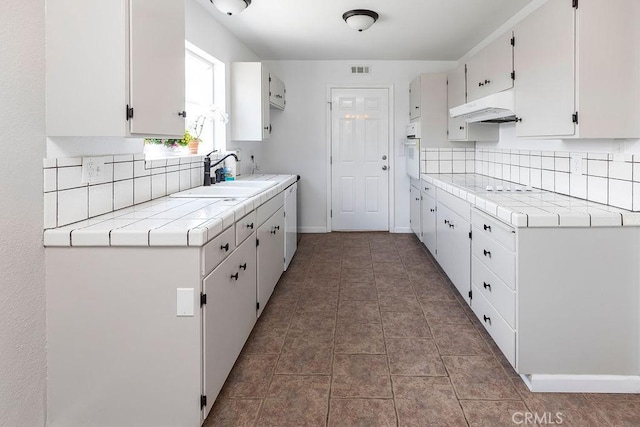 3760 Fielding Cir, Sacramento, CA 95826 - kitchen with white appliances, a sink, backsplash, under cabinet range hood, and tile counters
