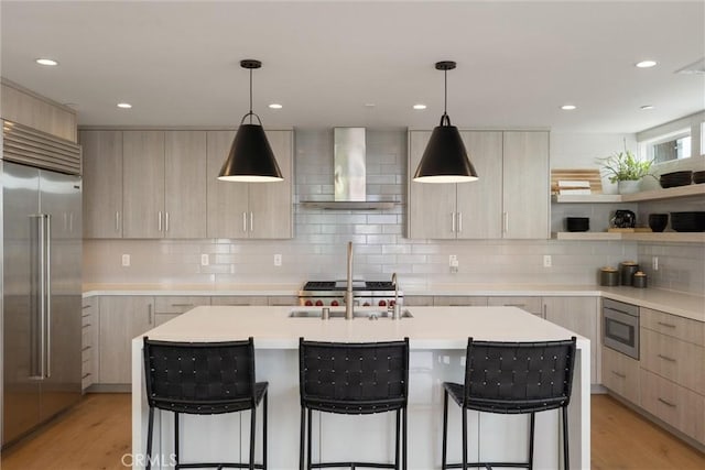 222 2nd St, Hermosa Beach, CA 90254 - kitchen with built in appliances, wall chimney exhaust hood, modern cabinets, light brown cabinetry, and recessed lighting
