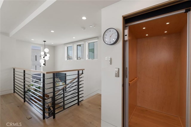 222 2nd St, Hermosa Beach, CA 90254 - corridor featuring an upstairs landing, wood finished floors, elevator, and recessed lighting
