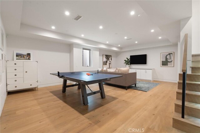222 2nd St, Hermosa Beach, CA 90254 - rec room with a tray ceiling, light wood-style floors, and recessed lighting