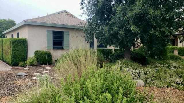 9083 Olive St, Temple City, CA 91780 - view of home's exterior with stucco siding and roof with shingles