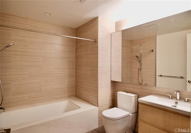877 Francisco St Unit 1903, Los Angeles, CA 90017 - bathroom with shower / washtub combination, vanity, toilet, and tile walls
