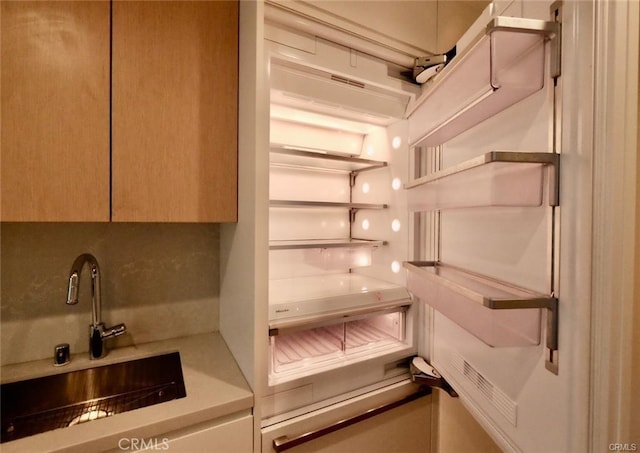 877 Francisco St Unit 1903, Los Angeles, CA 90017 - kitchen view of a sink, paneled refrigerator, and light countertops