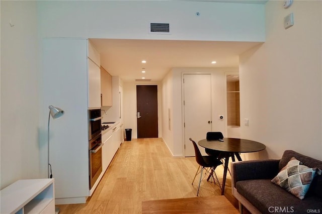 877 Francisco St Unit 1903, Los Angeles, CA 90017 - hallway with light wood finished floors and recessed lighting