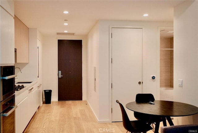 877 Francisco St Unit 1903, Los Angeles, CA 90017 - dining room with light wood-style floors and recessed lighting