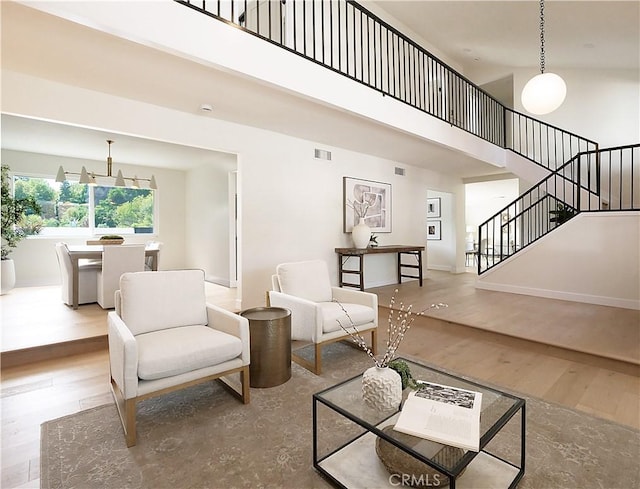 26633 Academy Dr, Palos Verdes Peninsula, CA 90274 - living room featuring a high ceiling, stairs, and wood finished floors