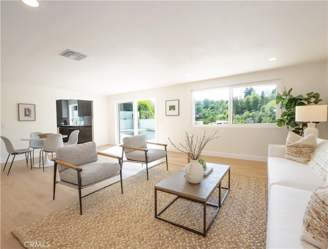 26633 Academy Dr, Palos Verdes Peninsula, CA 90274 - living room with plenty of natural light, light wood-style flooring, and recessed lighting