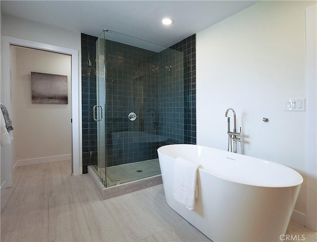 26633 Academy Dr, Palos Verdes Peninsula, CA 90274 - bathroom featuring wood finished floors, a shower stall, a freestanding bath, and recessed lighting