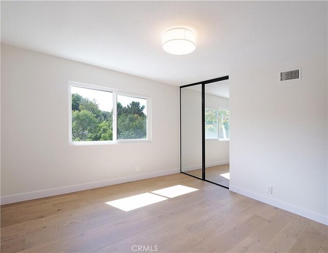 26633 Academy Dr, Palos Verdes Peninsula, CA 90274 - unfurnished bedroom featuring light wood-style floors and a closet