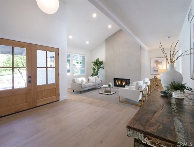 26633 Academy Dr, Palos Verdes Peninsula, CA 90274 - living room with high vaulted ceiling, light wood finished floors, a tile fireplace, and recessed lighting