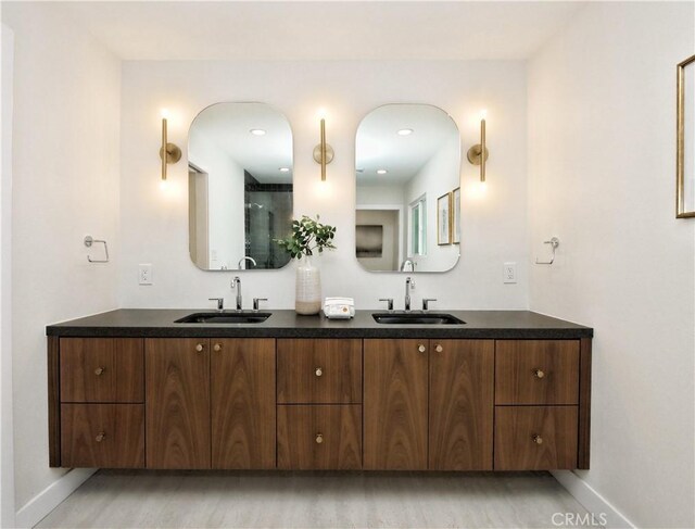 26633 Academy Dr, Palos Verdes Peninsula, CA 90274 - bathroom featuring double vanity and wood finished floors