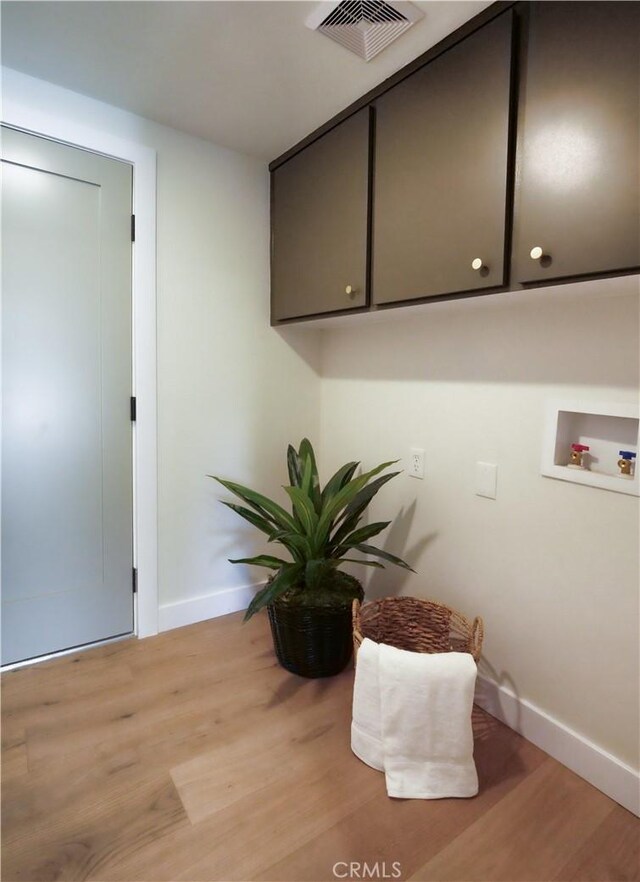 26633 Academy Dr, Palos Verdes Peninsula, CA 90274 - laundry area featuring washer hookup, light wood-style floors, and cabinet space