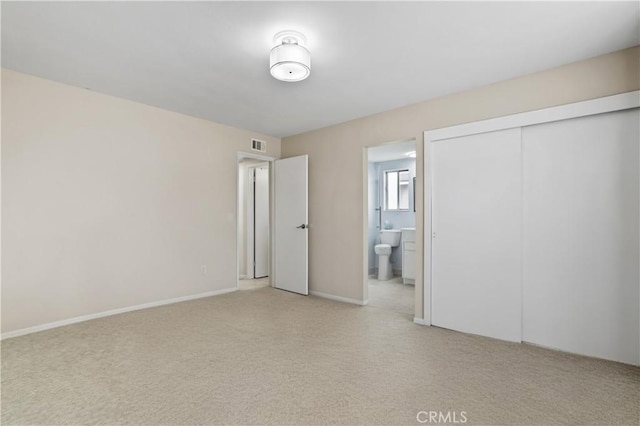 1432 N Shaffer St, Orange, CA 92867 - unfurnished bedroom featuring light colored carpet, a closet, and ensuite bath