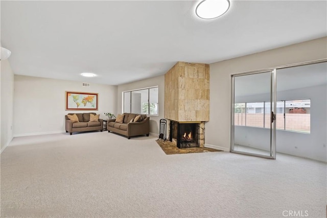 1432 N Shaffer St, Orange, CA 92867 - living area with a tiled fireplace and carpet flooring