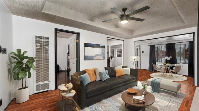 3902 Live Oak St, Cudahy, CA 90201 - living room with a heating unit, a raised ceiling, a textured ceiling, wood finished floors, and a ceiling fan
