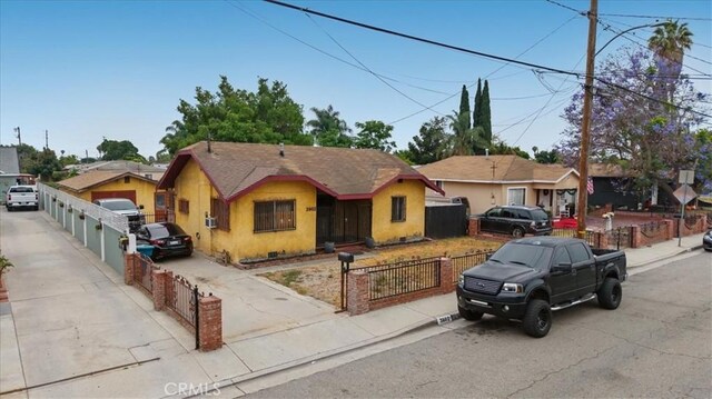 3902 Live Oak St, Cudahy, CA 90201 - bungalow-style home with a fenced front yard and stucco siding