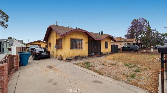 3902 Live Oak St, Cudahy, CA 90201 - bungalow-style house with concrete driveway and stucco siding