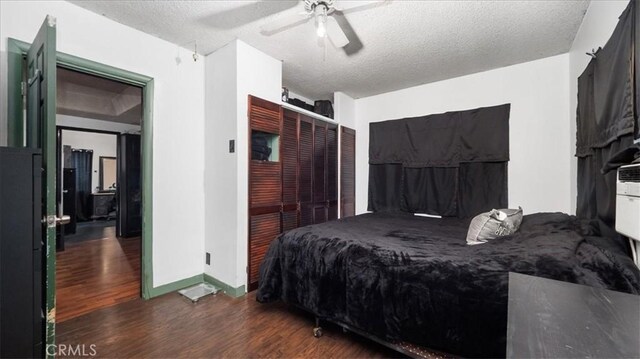 3902 Live Oak St, Cudahy, CA 90201 - bedroom featuring wood finished floors, a textured ceiling, a ceiling fan, baseboards, and a closet