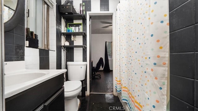 3902 Live Oak St, Cudahy, CA 90201 - full bath with toilet, vanity, a shower with shower curtain, and tile walls