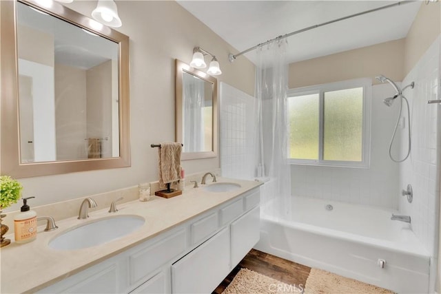 3074 Mountain Top Dr, Highland, CA 92346 - full bath featuring shower / tub combination, double vanity, and wood finished floors
