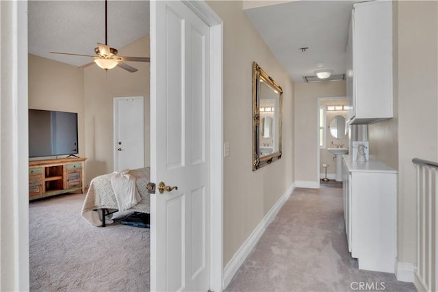 3074 Mountain Top Dr, Highland, CA 92346 - corridor featuring light carpet and baseboards