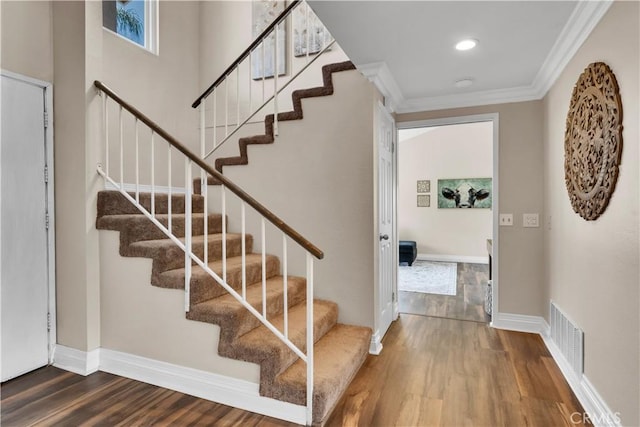 3074 Mountain Top Dr, Highland, CA 92346 - staircase featuring wood finished floors, ornamental molding, and baseboards