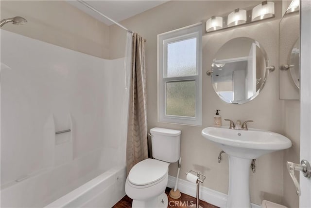 3074 Mountain Top Dr, Highland, CA 92346 - bathroom with toilet, shower / bath combo, and baseboards