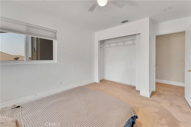 3074 Mountain Top Dr, Highland, CA 92346 - unfurnished bedroom with light colored carpet, a closet, baseboards, and ceiling fan