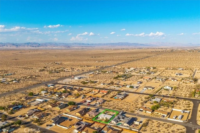 6646 Quail Spring Ave Unit 29, Palms, CA 92277 - aerial view of property's location featuring a desert landscape, a mountainous background, and rural landscape