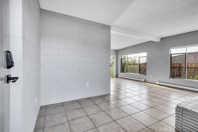 6646 Quail Spring Ave Unit 29, Palms, CA 92277 - spare room with baseboard heating, a textured ceiling, beamed ceiling, and tile patterned flooring