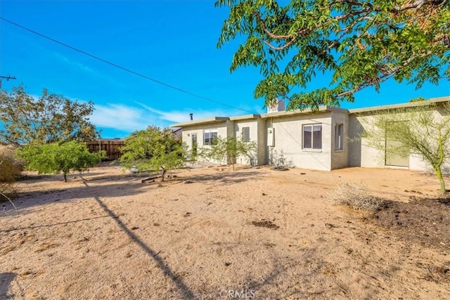 6646 Quail Spring Ave Unit 29, Palms, CA 92277 - rear view of property with stucco siding