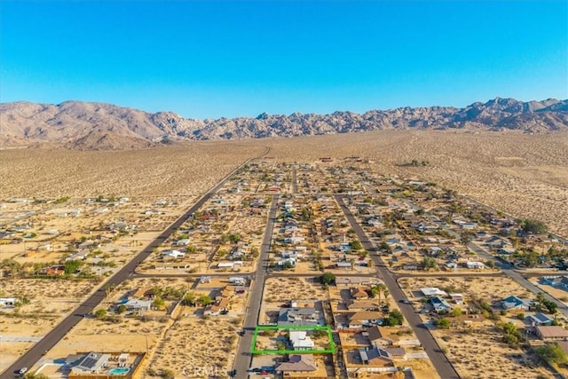 6646 Quail Spring Ave Unit 29, Palms, CA 92277 - drone / aerial view of a mountain backdrop and a desert landscape