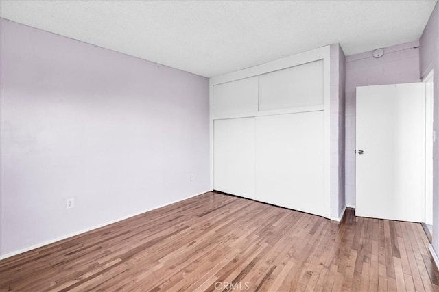 6646 Quail Spring Ave Unit 29, Palms, CA 92277 - unfurnished bedroom featuring light wood-style floors and a closet