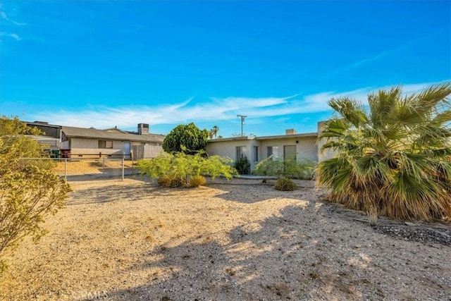 6646 Quail Spring Ave Unit 29, Palms, CA 92277 - rear view of property with stucco siding