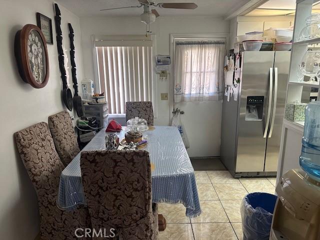 2440 Merrywood St, Pomona, CA 91767 - dining room featuring a ceiling fan and light tile patterned flooring