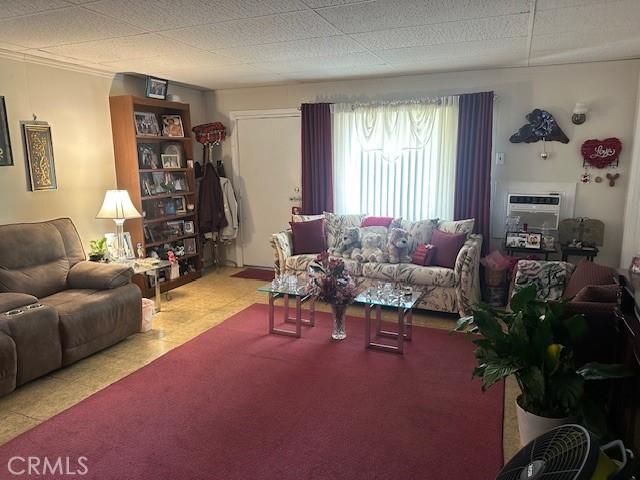 2440 Merrywood St, Pomona, CA 91767 - living area featuring a wall mounted air conditioner