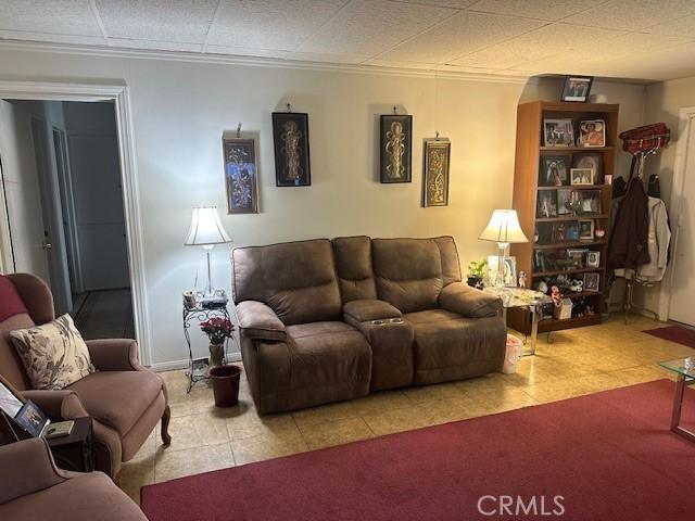 2440 Merrywood St, Pomona, CA 91767 - tiled living area featuring ornamental molding