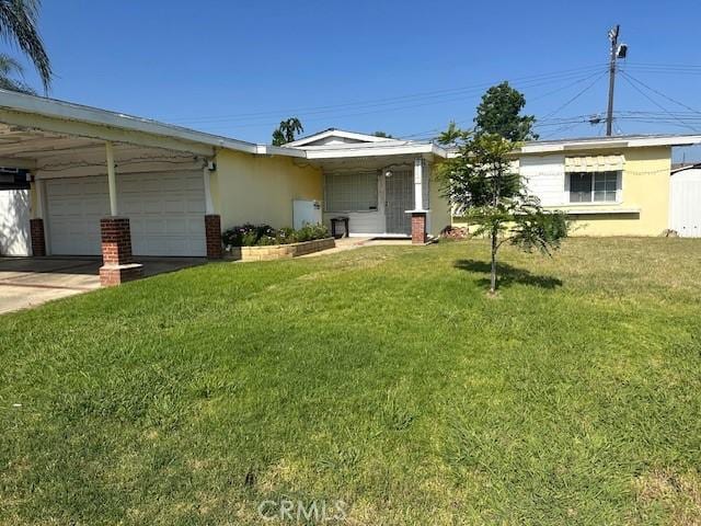 2440 Merrywood St, Pomona, CA 91767 - view of front of property featuring stucco siding, a front yard, a garage, and driveway
